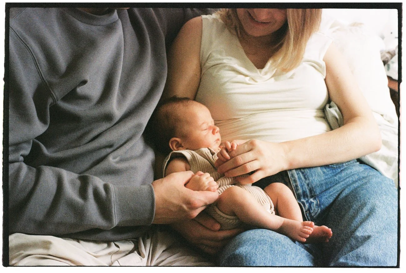 family-portraiture-newborn-in-parents-arms.001.jpg