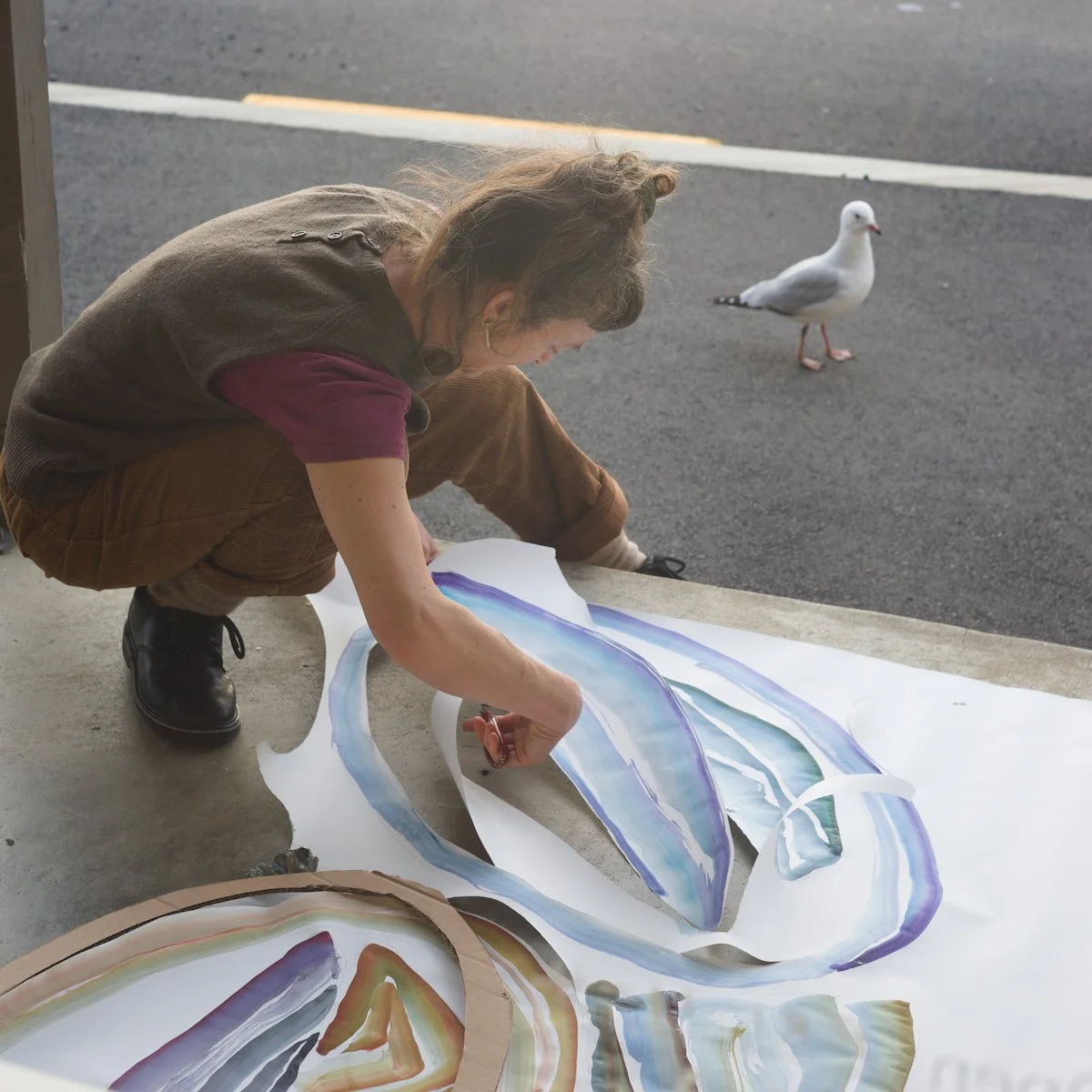 Yasmin Dubrau creating a window installation at Midden, Portobello, 2024