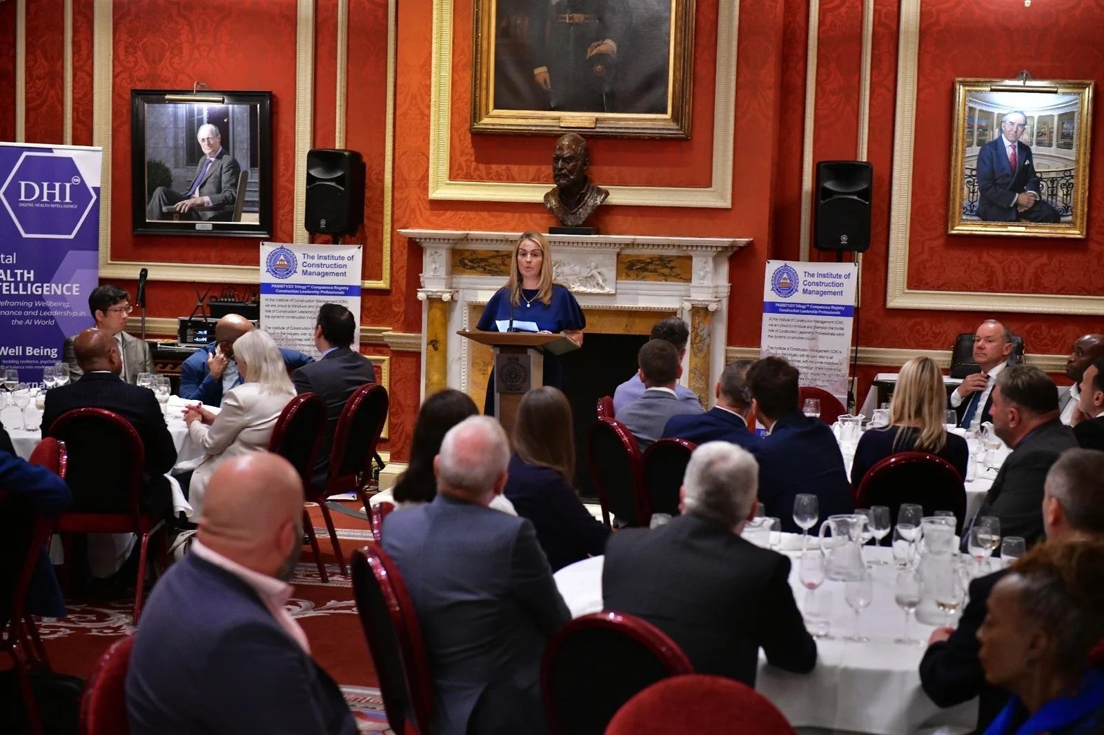 Louize Clark delivering a keynote for high net worth business owners and leaders in the construction supply chain, London