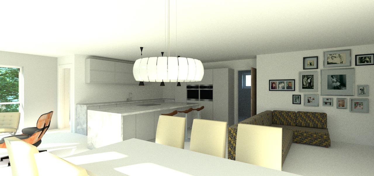 Open-concept living and dining area with a white kitchen island, yellow dining chairs, a patterned sectional sofa, and a gallery wall of framed photos.