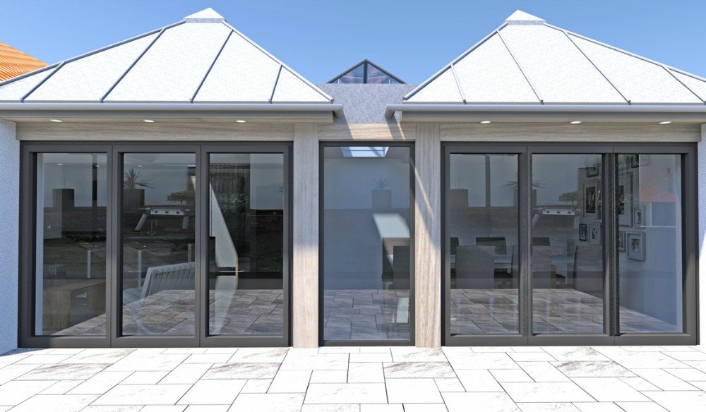 Modern house with three large sliding glass doors leading to a patio, with a metal roof and a glass pyramid skylight.