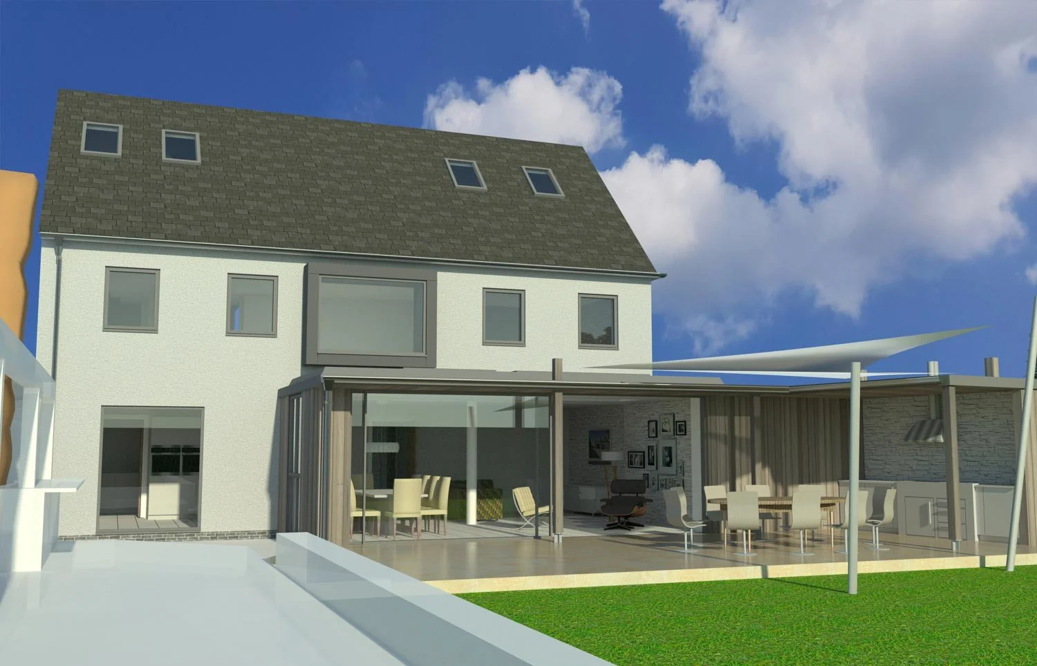 Modern two-story house with a dark gray gable roof, white exterior walls, and an outdoor patio area with chairs and a table, set against a blue sky with clouds.