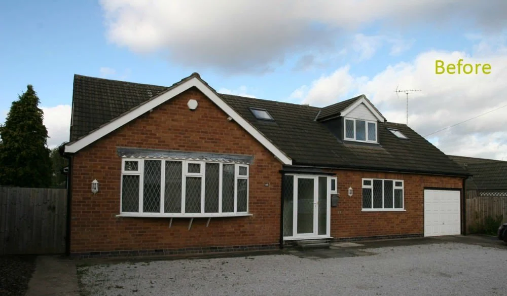 A brick house with multiple windows and a garage, labeled 'Before' in the upper right corner.