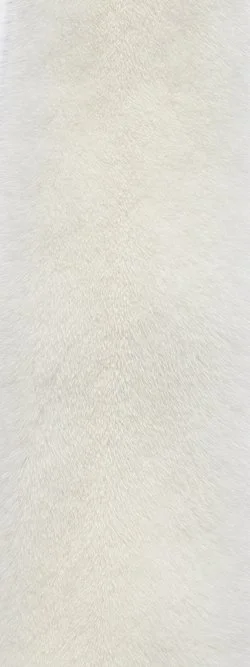 Close-up of a white, textured fabric surface.