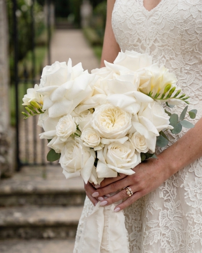 Our bridal designs are a study in form and elegance. For the modern traditionalist, we create bespoke bouquets using the finest white roses and calla lilies, ensuring the botanical silhouette perfectly complements the intricate details of a bride.