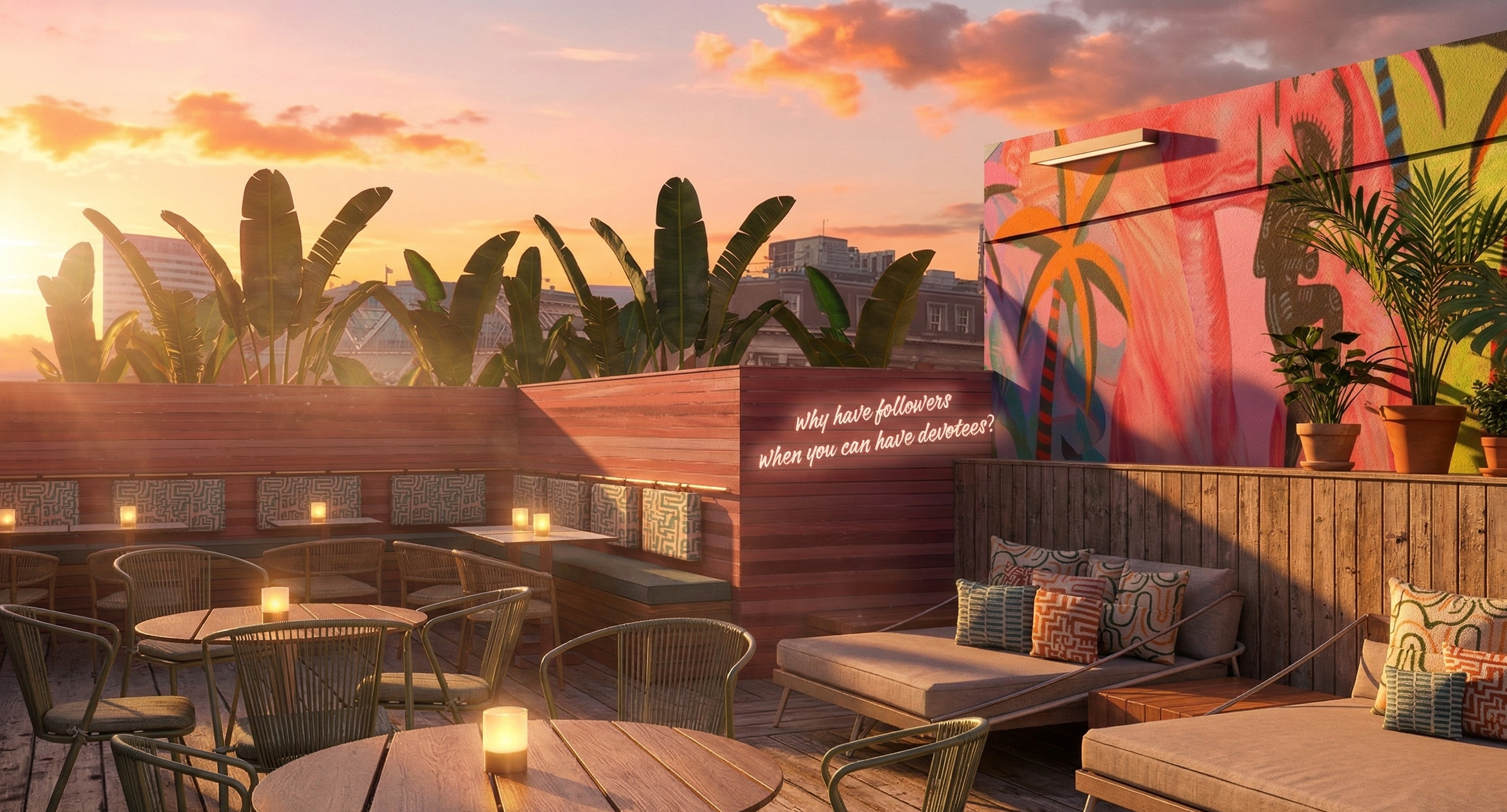 A rooftop patio with wooden flooring, outdoor seating, and potted plants at sunset. There's a colorful mural on the wall and a neon sign with the quote 'Why have followers when you can have devotees?'.