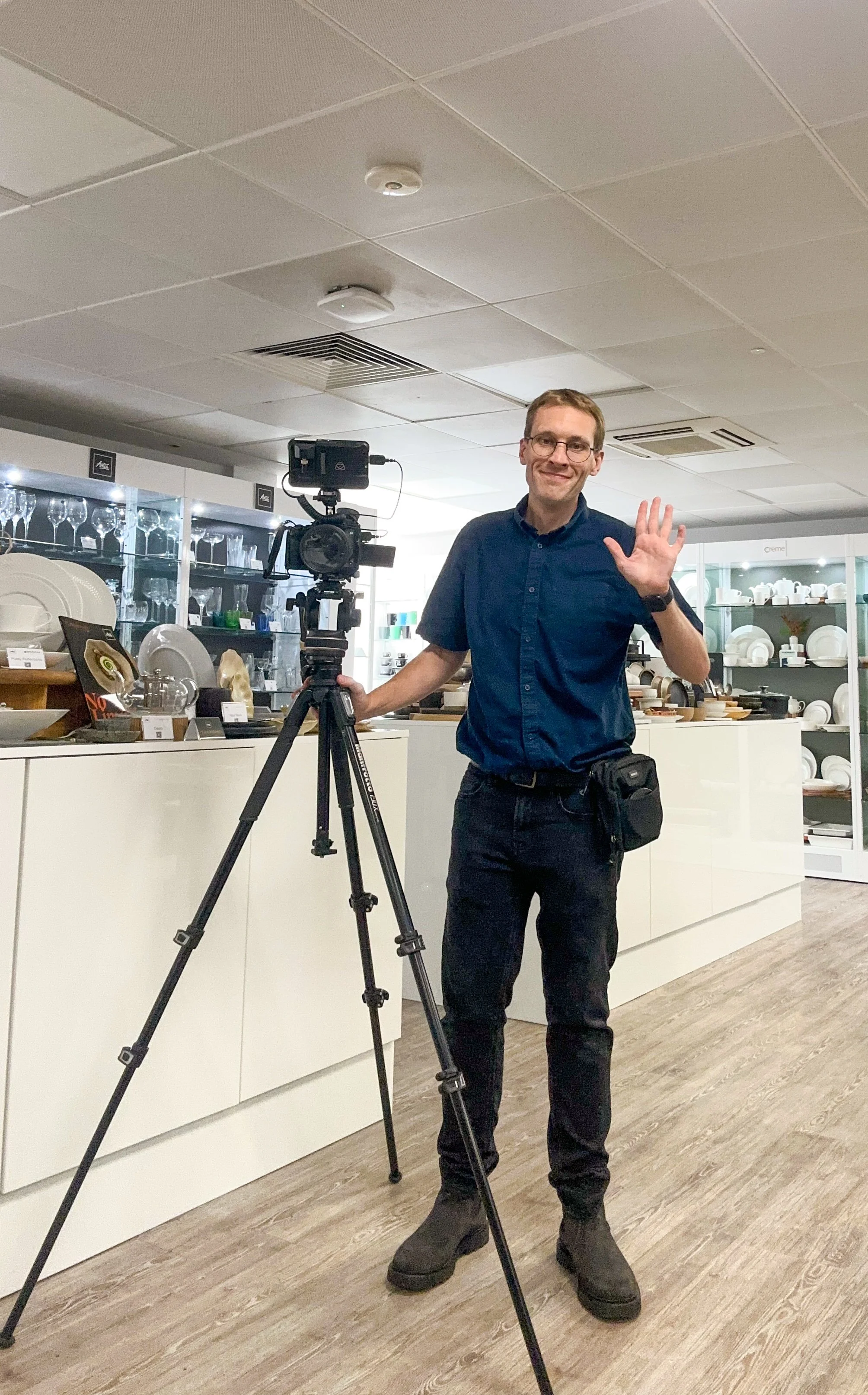 James Watts filming on location and a client takes a behind the scenes shot of him.