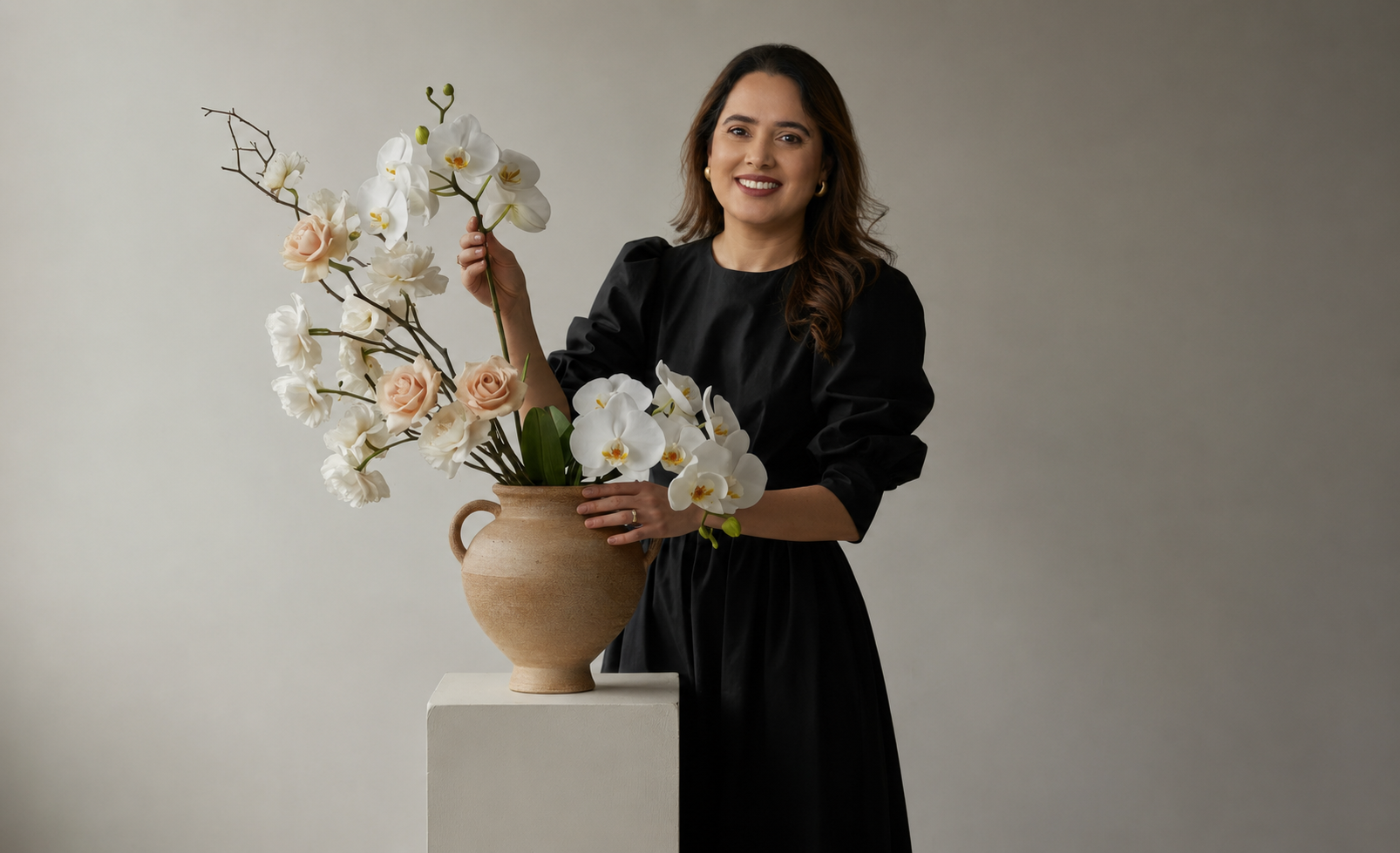 Huma Zareef, interior designer in Leeds, styling flowers in a calm neutral home interior.