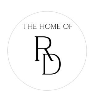 Logo with text 'The Home of RD' inside a circle representing rattan direct.