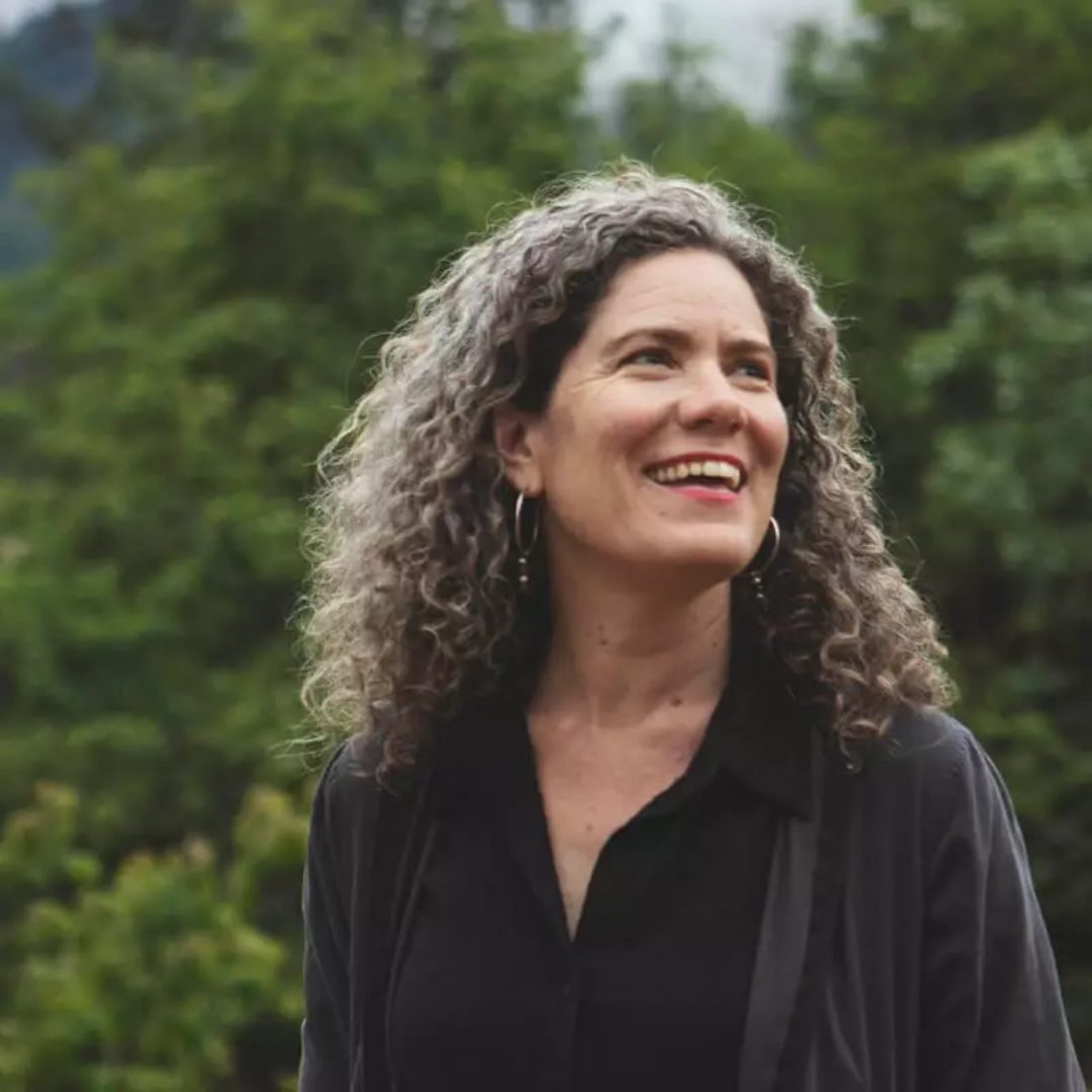 Fermentation educator, Kirsten Shockey, smiling outdoors in natural setting, representing teaching and knowledge-sharing at a fermentation residency