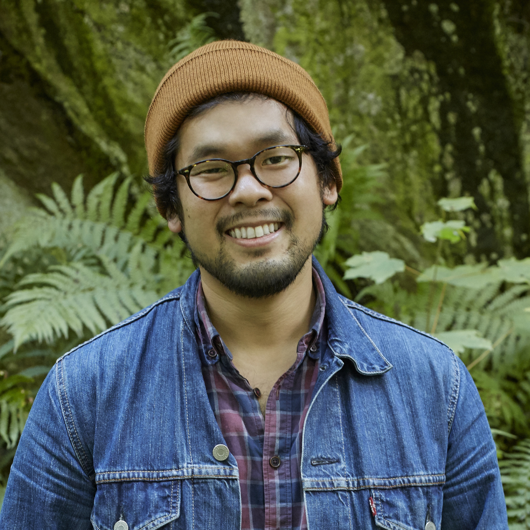 Fermentation workshop participant. Kenji Morimoto. smiling outdoors, representing community learning at a food and fermentation residency