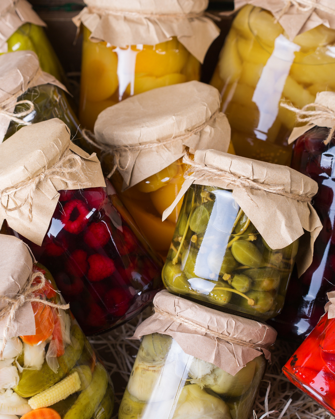 Assorted jars of fermented and preserved fruits and vegetables, sealed traditionally and prepared for long-term storage