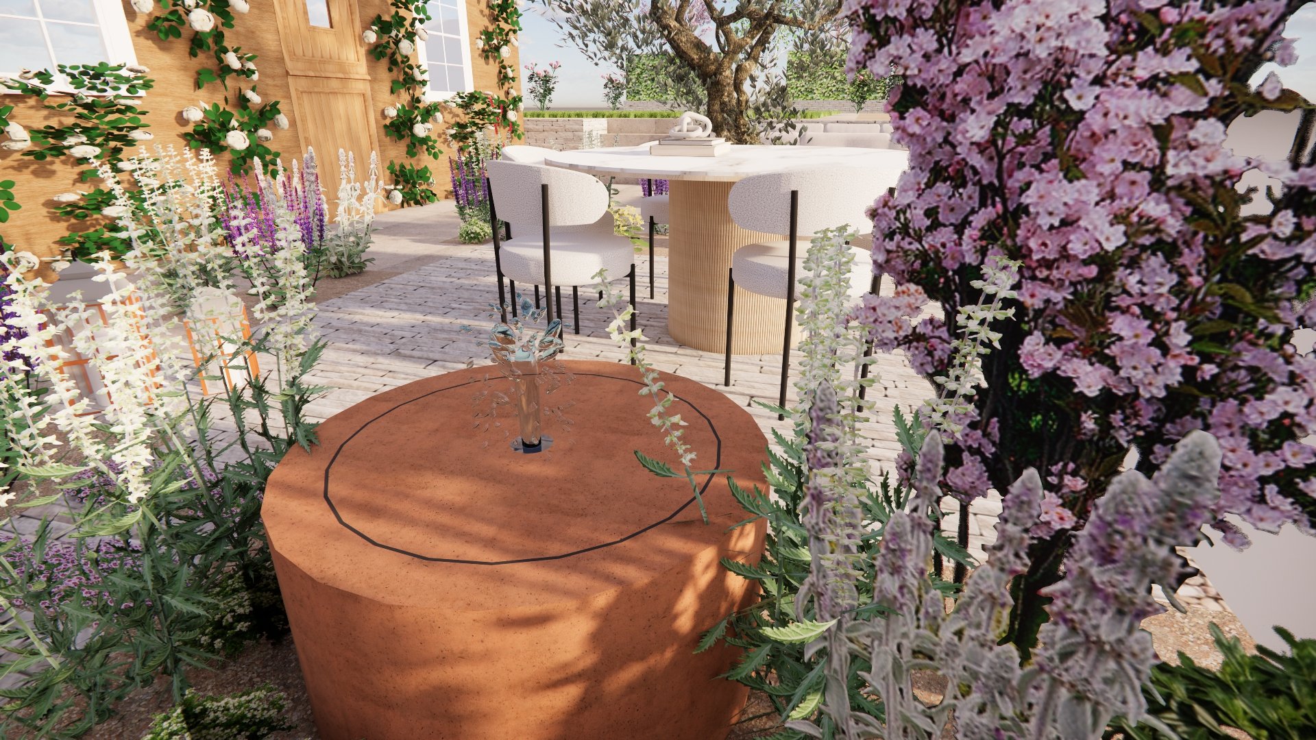 3D garden design render of a terrace with dining area, corten steel water bowl and a blossom tree among mixed perennial planting.