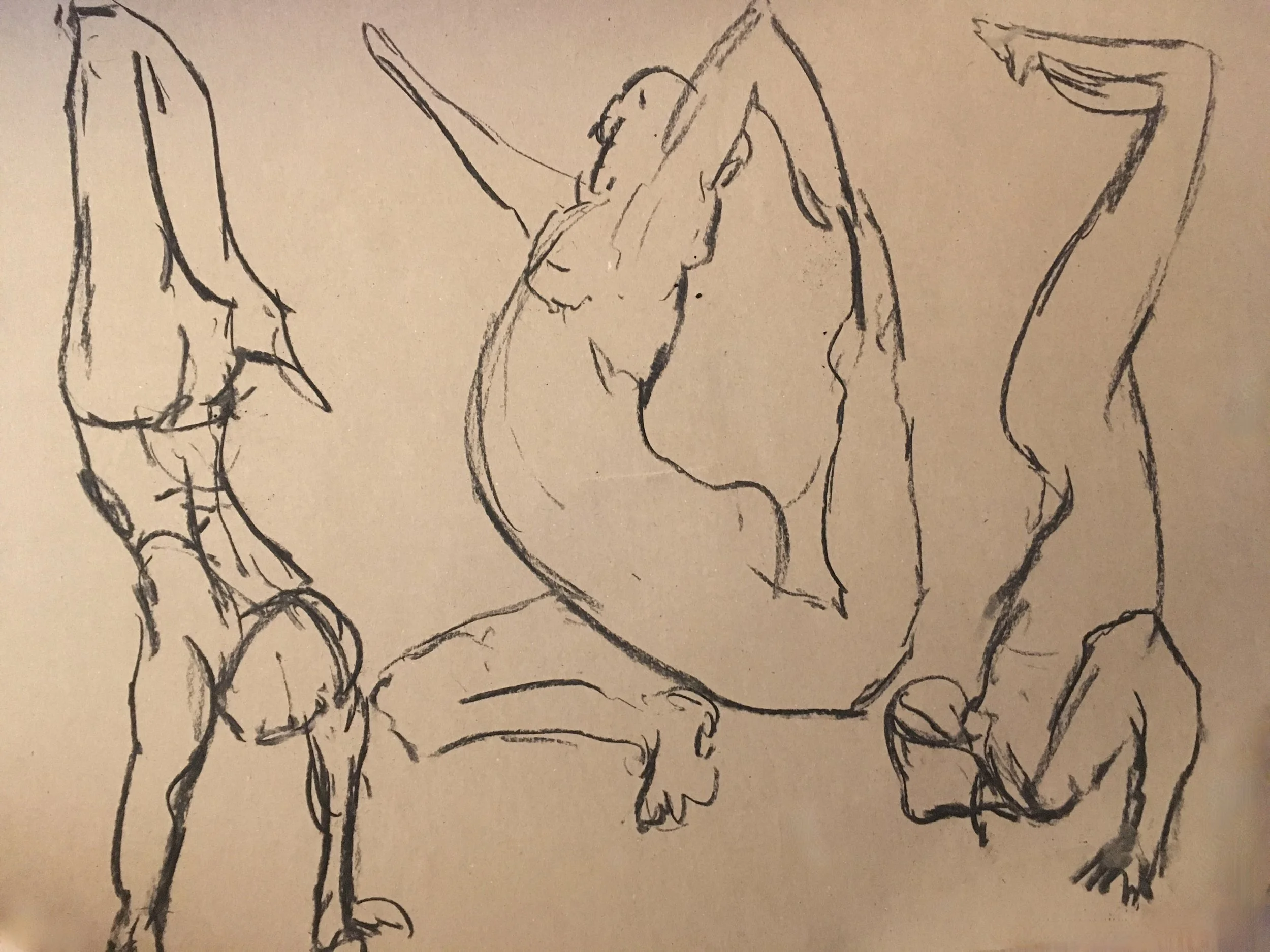 A rough sketch of several humanlike figures, with one prominently in the center, drawn with simple, loose lines in black ink on a light background.