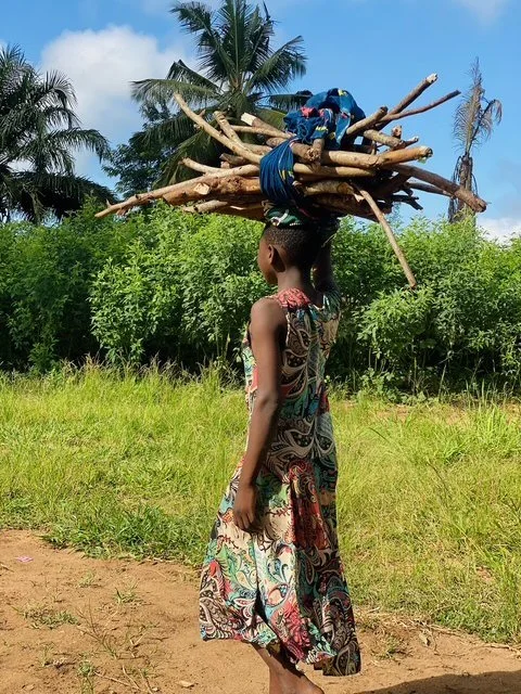 Woman carrying firewood in rural Tanzania