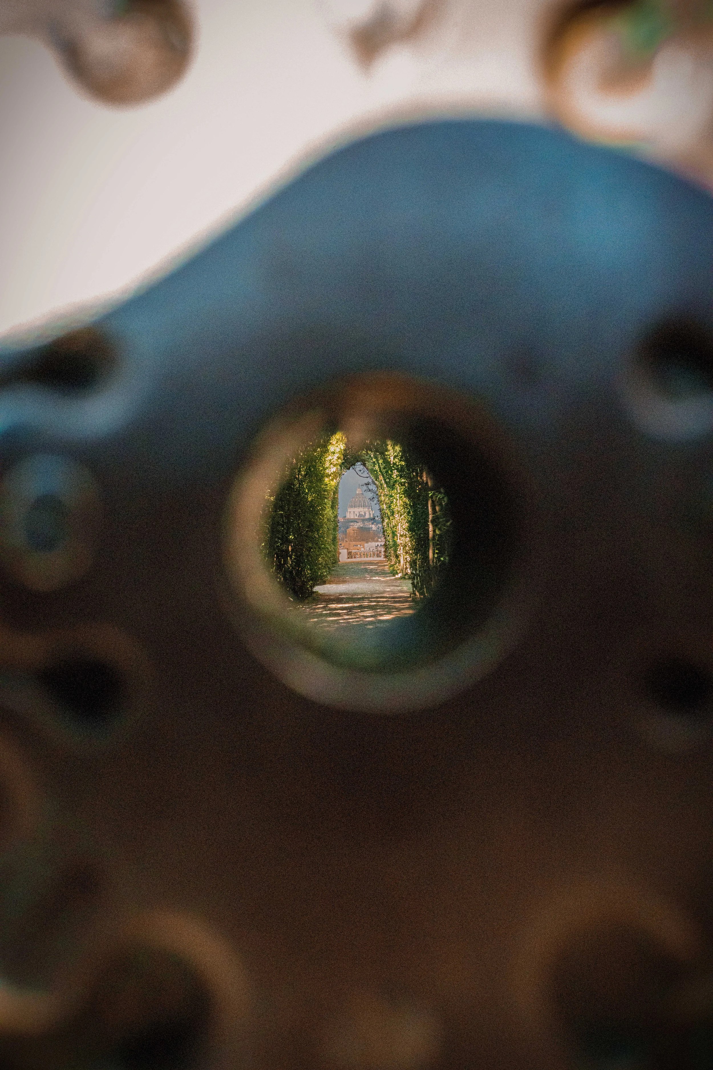 A viewpoint through a gun barrel showing the U.S. Capitol building in the distance.