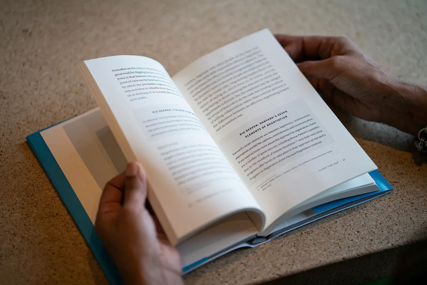 Reader holding an open book