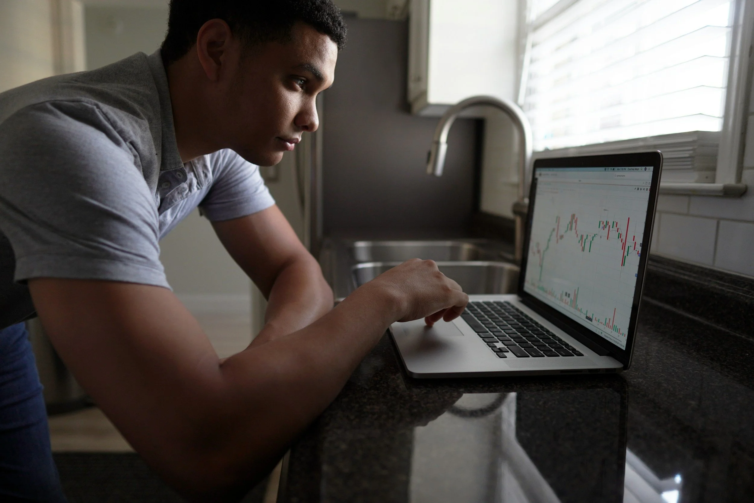 Man in a t-shirt looking at a graph of personality test results