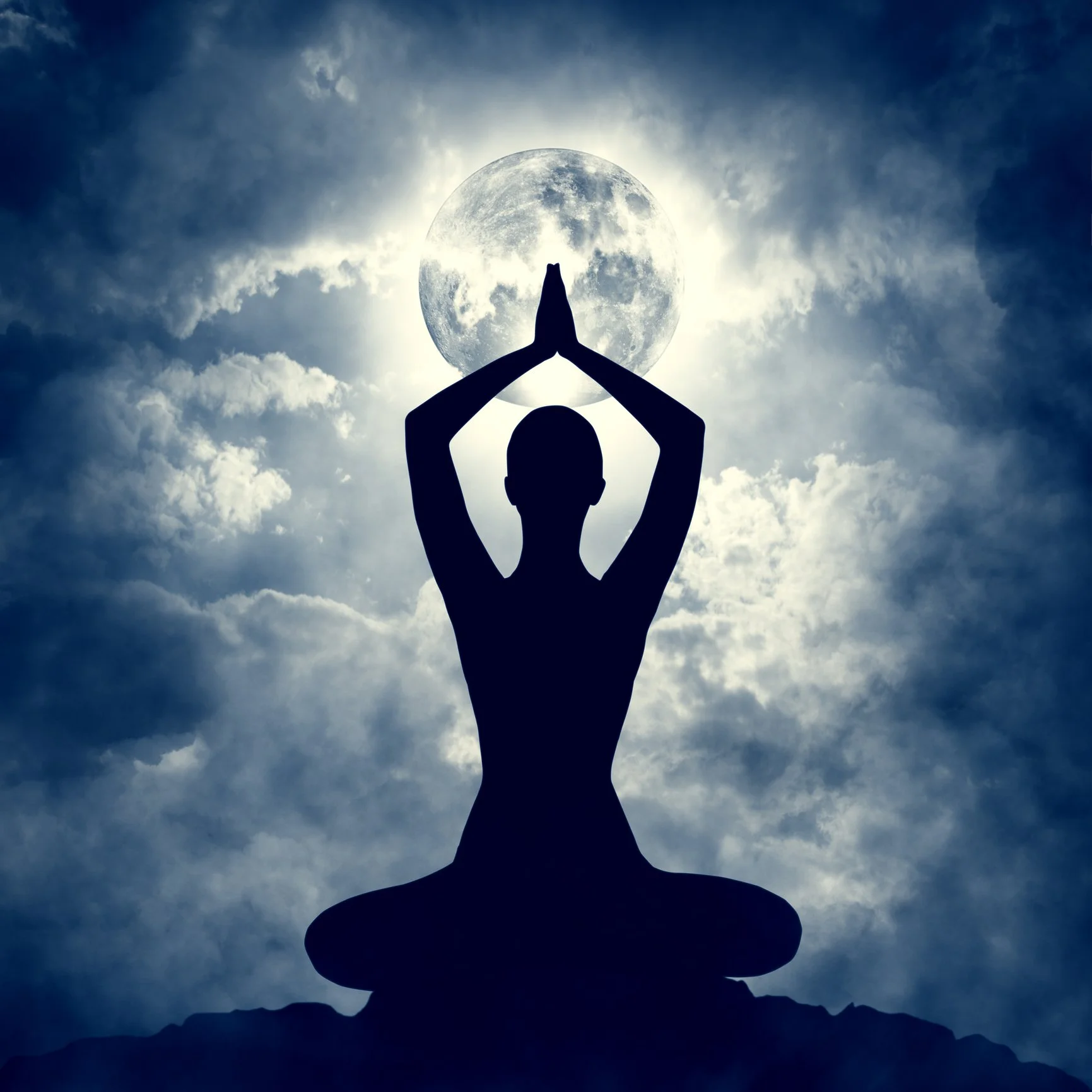 A person engaging in yoga and wellness practices under the moon.