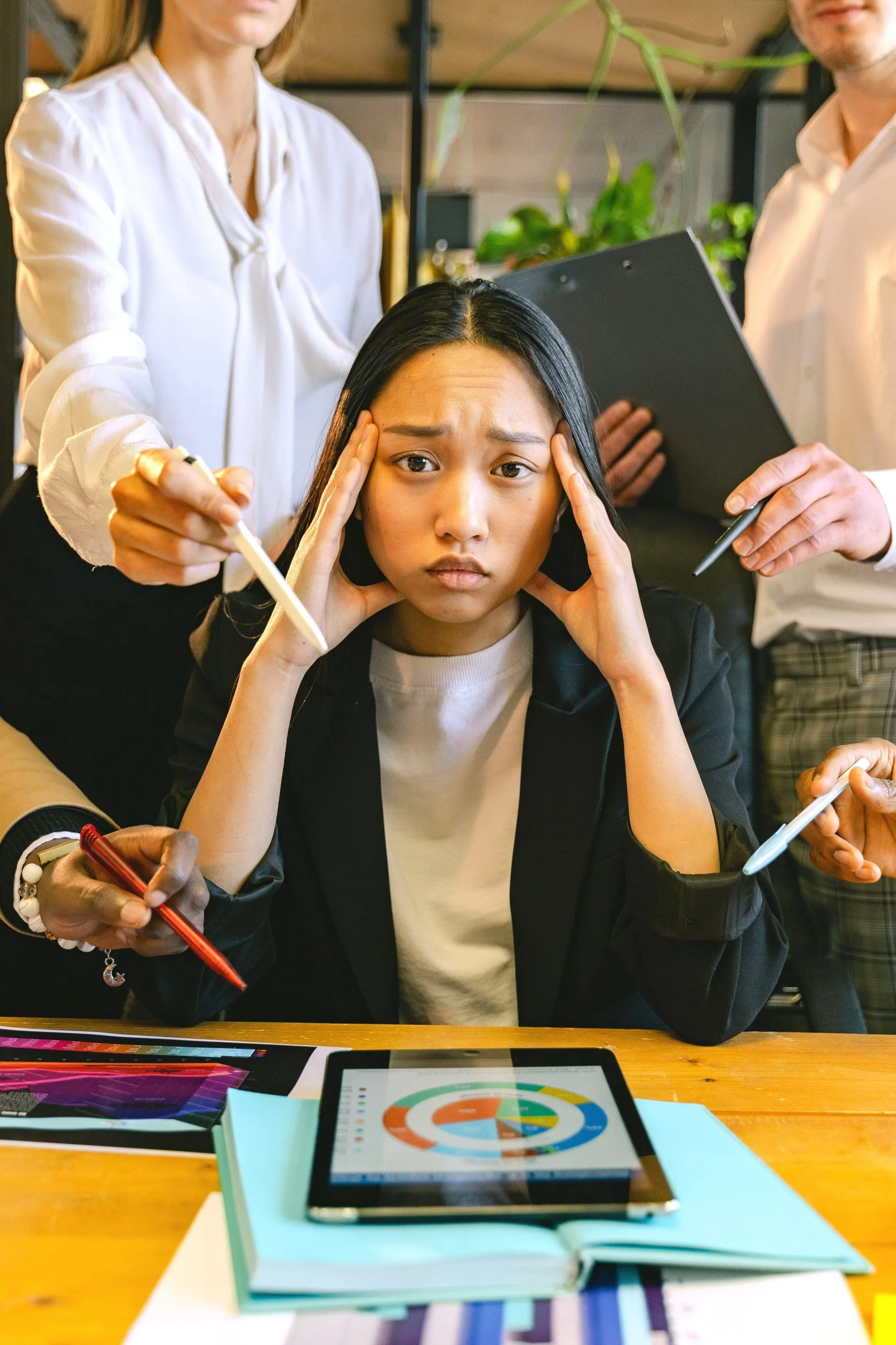 Photo of Asian woman at work, in high demand situation