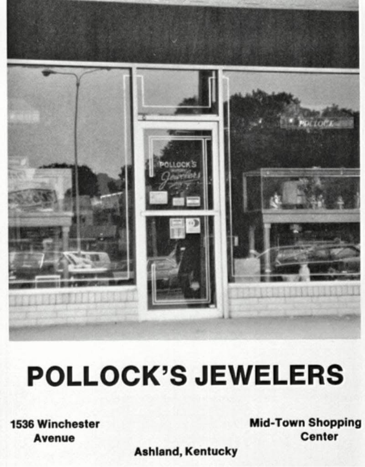 A black and white photo of the storefront for Pollock's Jewelers at 1536 Winchester Avenue in the Mid-Town Shopping Center, Ashland, Kentucky, showing the glass door and window, with cars and trees visible outside.