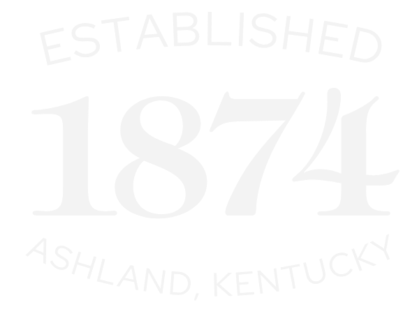A black circular emblem with white text that says "Established 1874 Ashland, Kentucky".