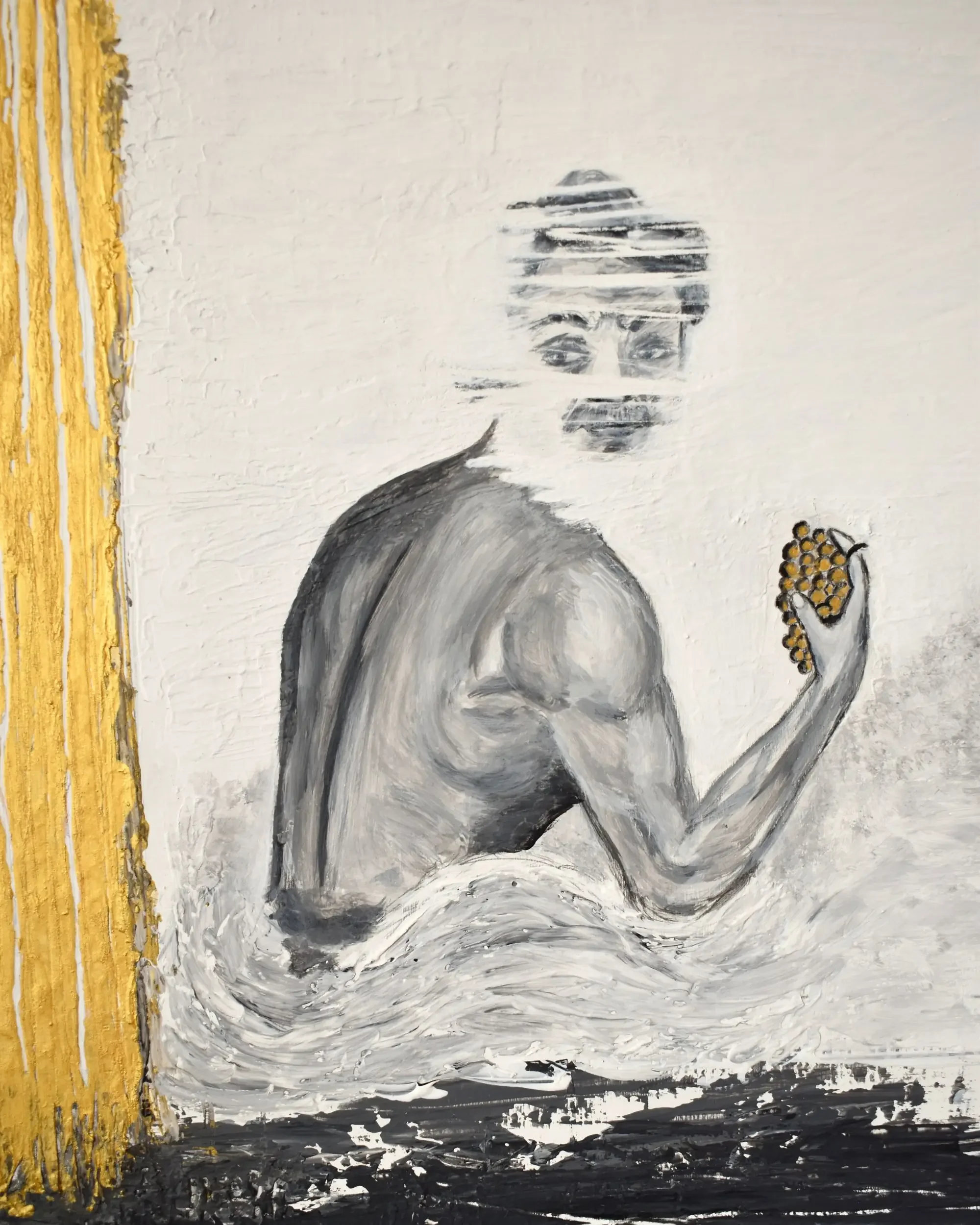 Close-up detail of Bacco. Where do we find peace?, a contemporary artwork by Francesca V Kranz, capturing the grey monochrome torso and hand with the golden grapes alongside the shimmering texture of the golden pillar.