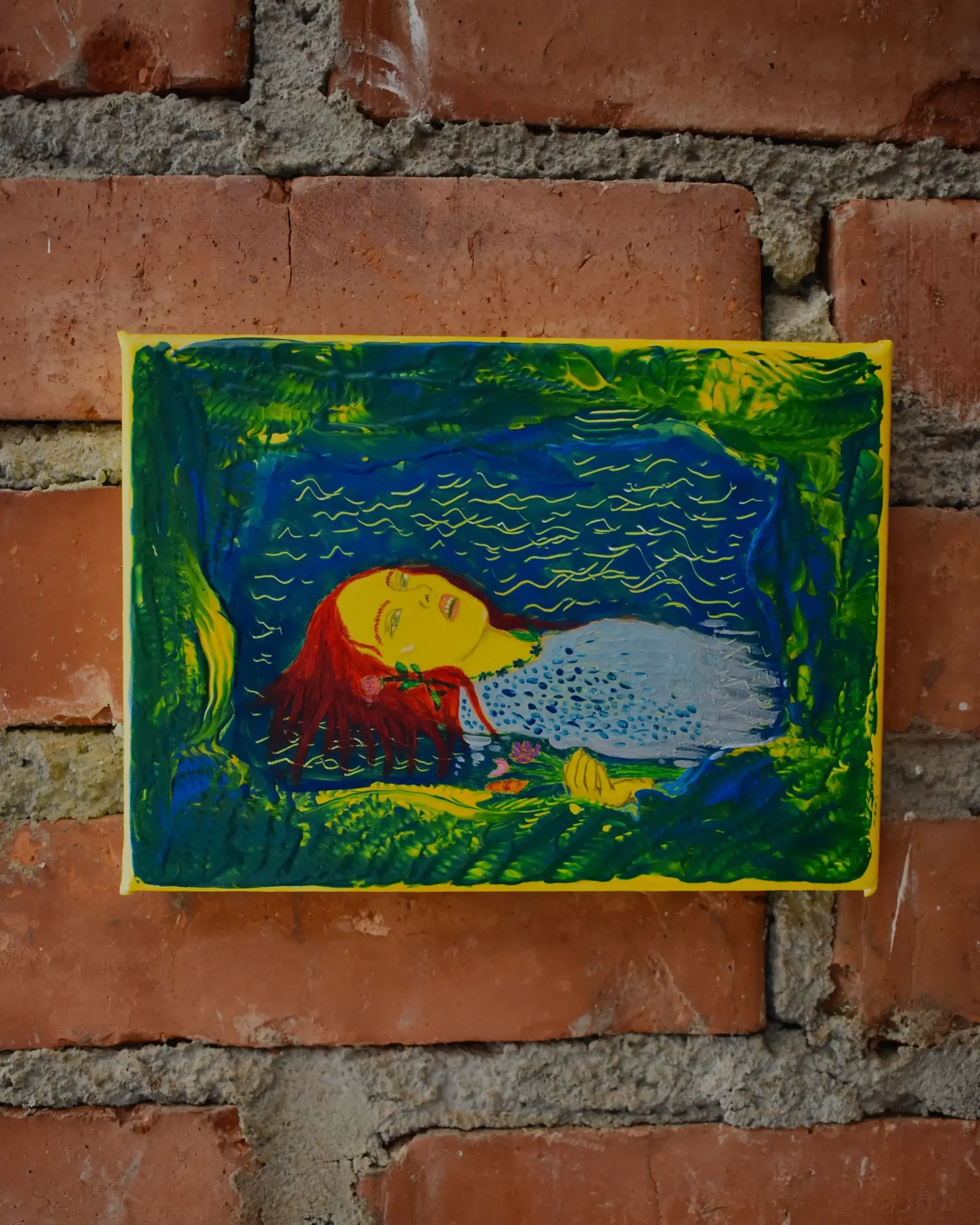 Full view of Ofelia. Back to Nature., a contemporary artwork by Francesca V Kranz, displaying the rectangular painting on a brick wall to highlight its vibrant green and yellow organic textures.