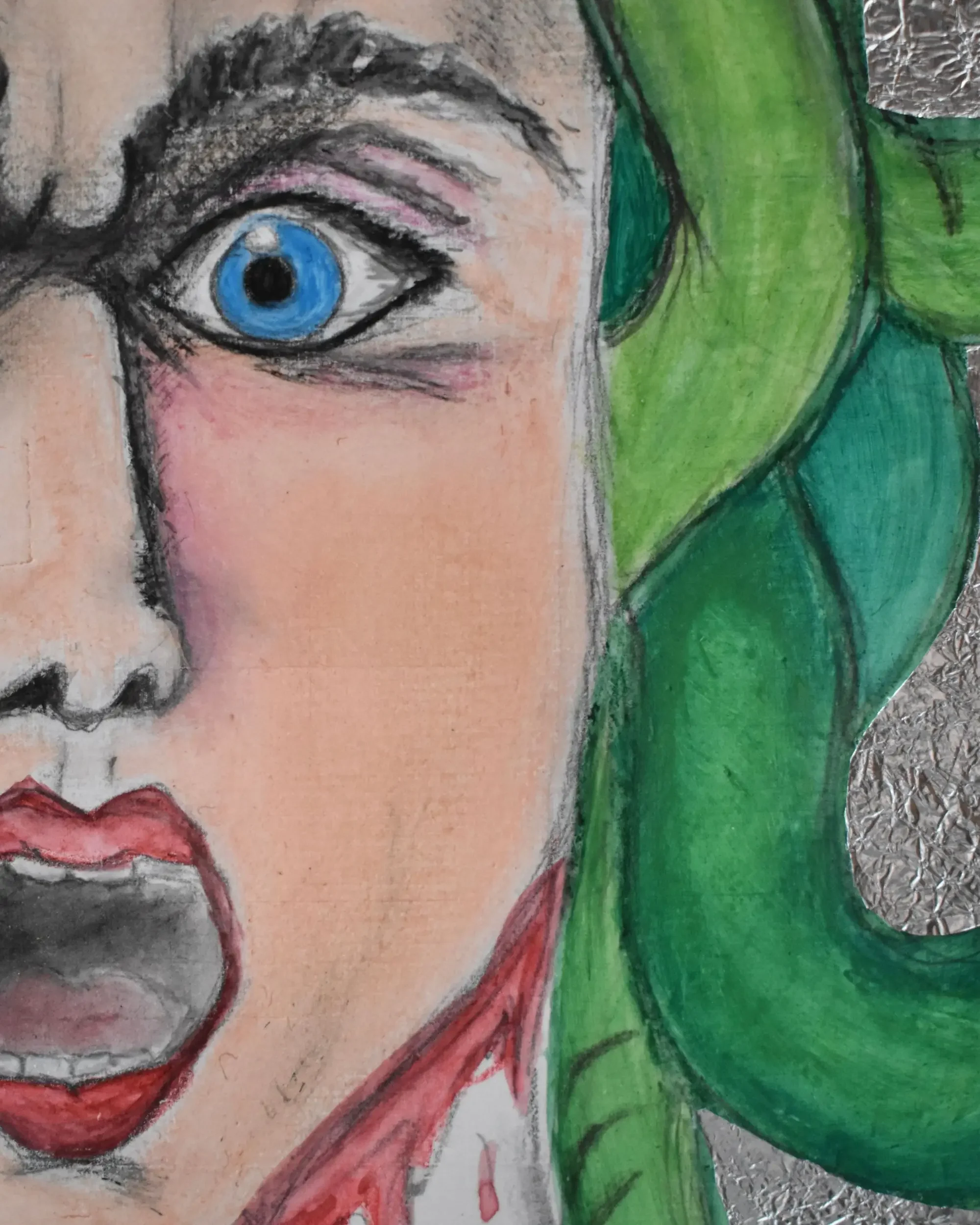 Close-up detail of Medusa. Mirror of Reflections., a contemporary artwork by Francesca V Kranz, highlighting the tragic and intense expression of the face, the wide blue eye, and the vivid green hair against the aluminum background.