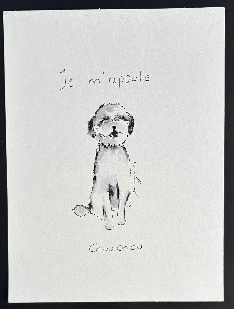 A white greeting card with a watercolor illustration of a small dog with fluffy ears and a tail, sitting on the ground. The card has handwritten French text that says "Je m'appelle" at the top and "Chouchou" at the bottom, meaning "My name is Choucho