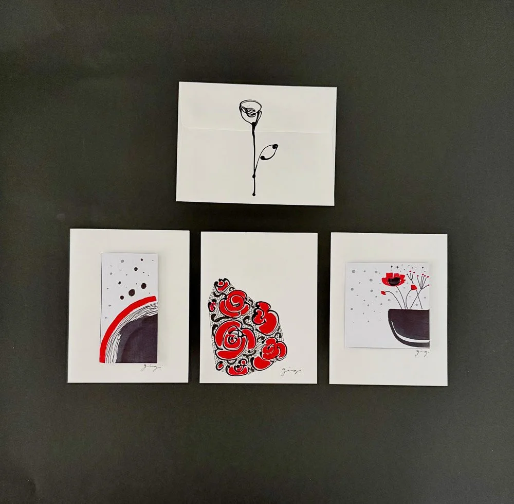 Set of four abstract flower-themed art prints, with one larger print at the top and three smaller prints below, all featuring black, red, and white colors on white backgrounds, displayed on a black surface.