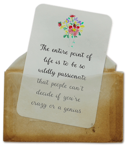A note card with a colorful flower illustration at the top, placed inside a brown paper envelope. The card contains an inspirational quote about passion and creativity.