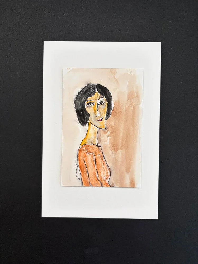 Watercolor portrait of a woman with short black hair, wearing an orange top, against a beige background.