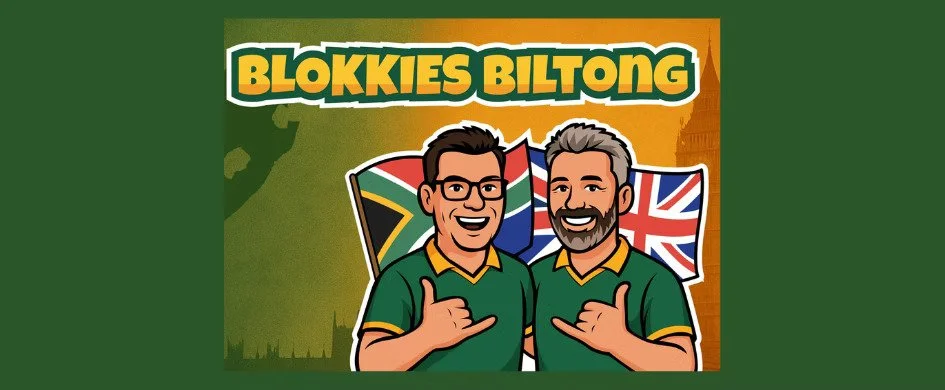 Illustration of two men wearing green shirts with yellow collars, smiling and gesturing with their hands, standing in front of South African and British flags, with the text 'Blokkies Biltong' above them.