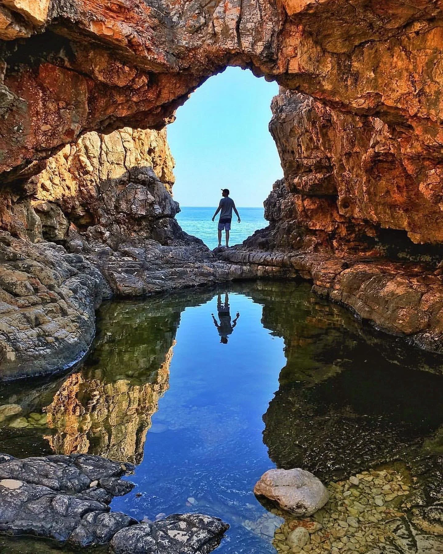 By the sea where dreams are made,
Golden sun in endless parade.
Waves that sing and winds that play,
A dance of light that fades to day.

Freedom calls with every tide,
Moments flow, no need to hide.
Footprints left upon the sand,
Traces of a life un