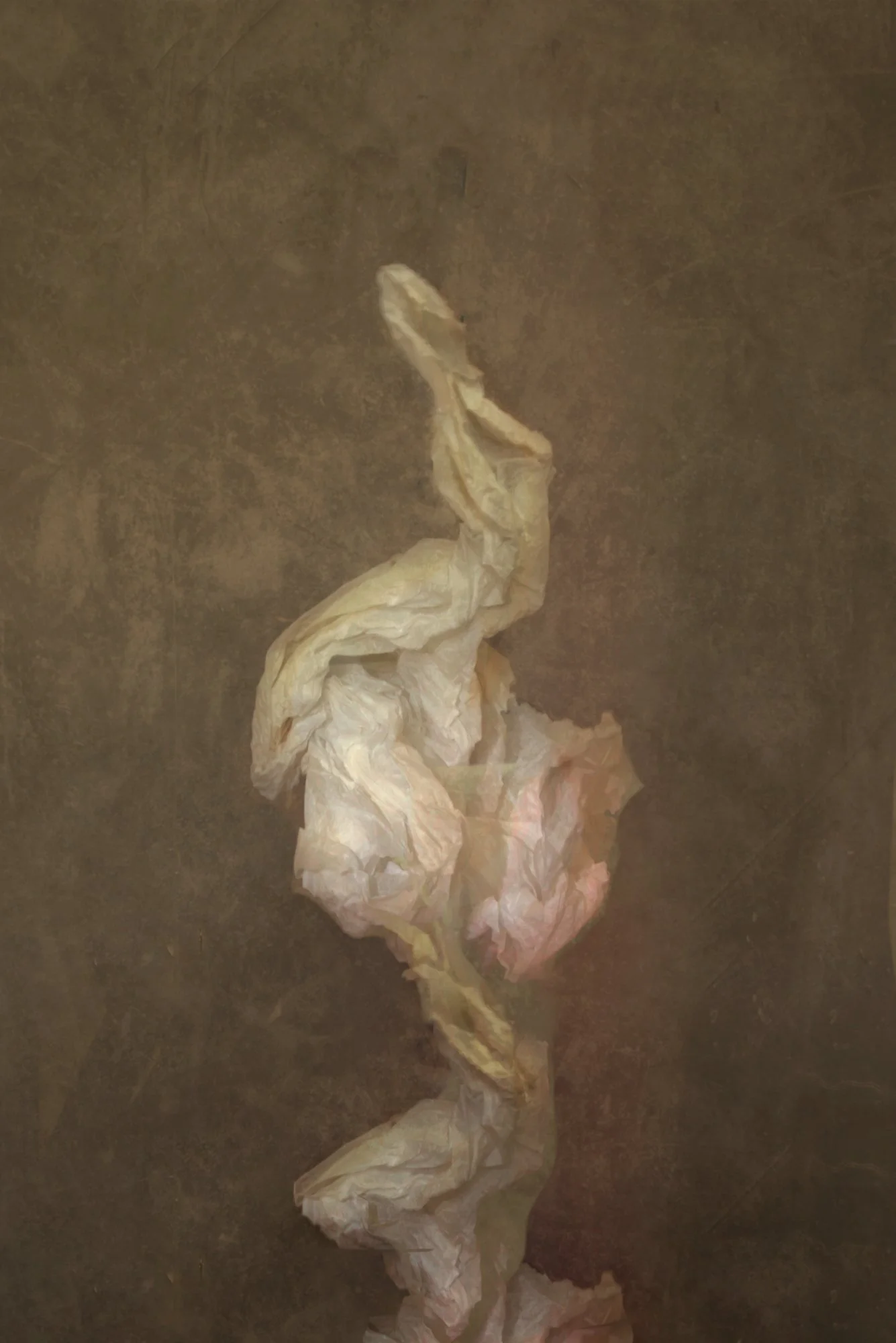 A crumpled piece of paper or tissue on a dark surface.