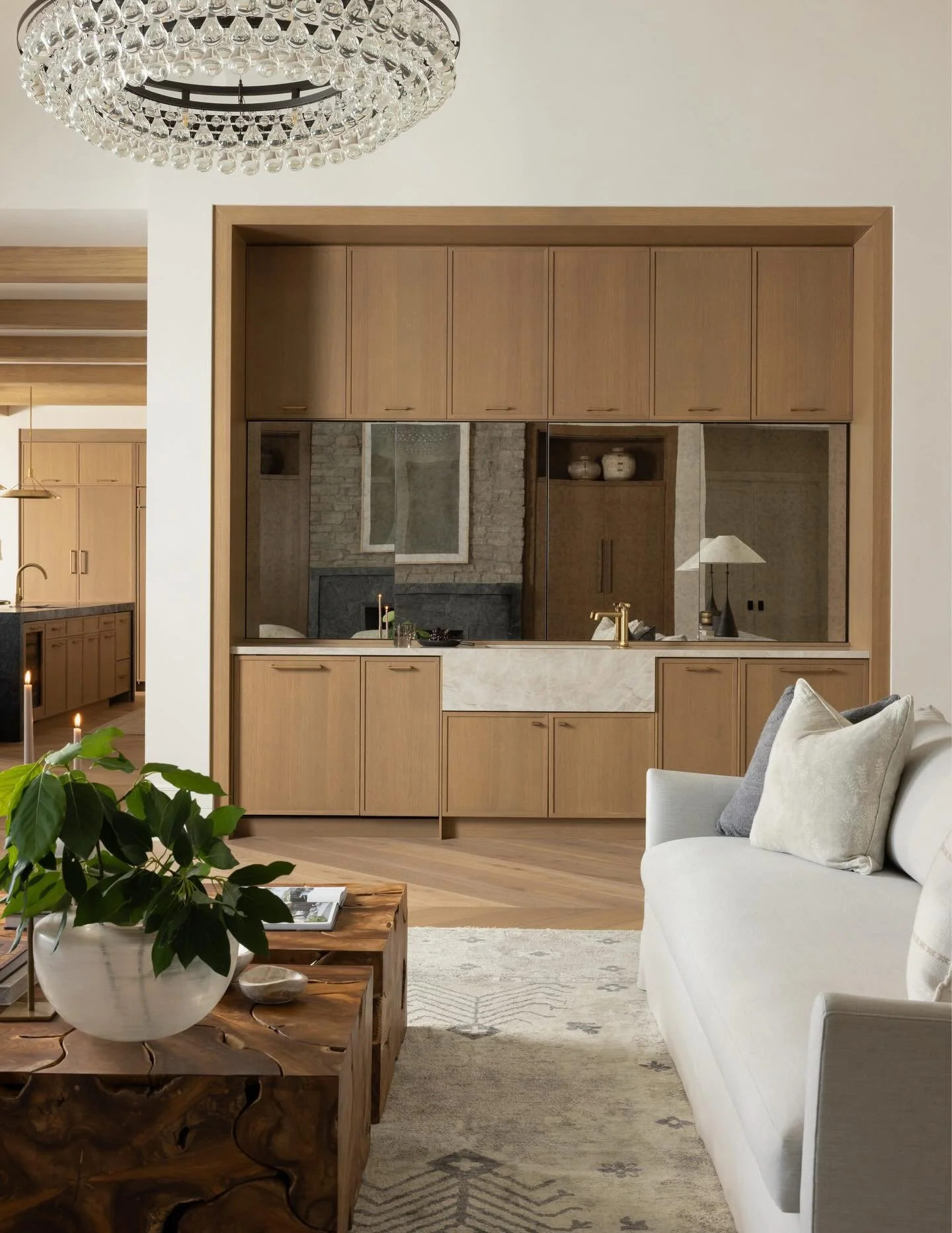This bar design features sleek smoked glass and seamless sliding doors. These are artful pieces designed to elevate your space while keeping your essentials elegantly tucked away.

Interior Design @ashleymartinhome 
Photography @nativehousephotograph