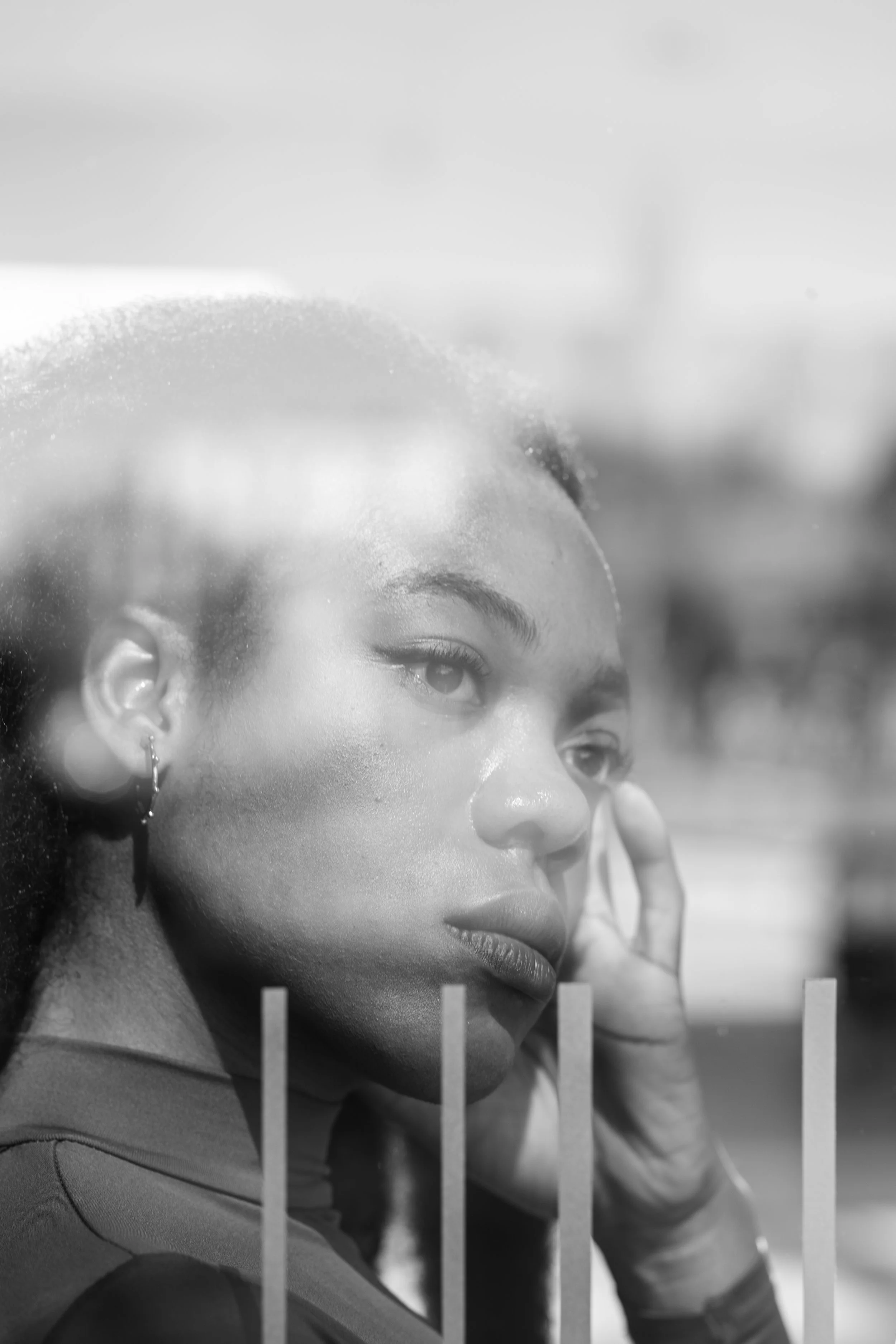 Black and white image of a woman in quiet reflection during a difficult emotional period