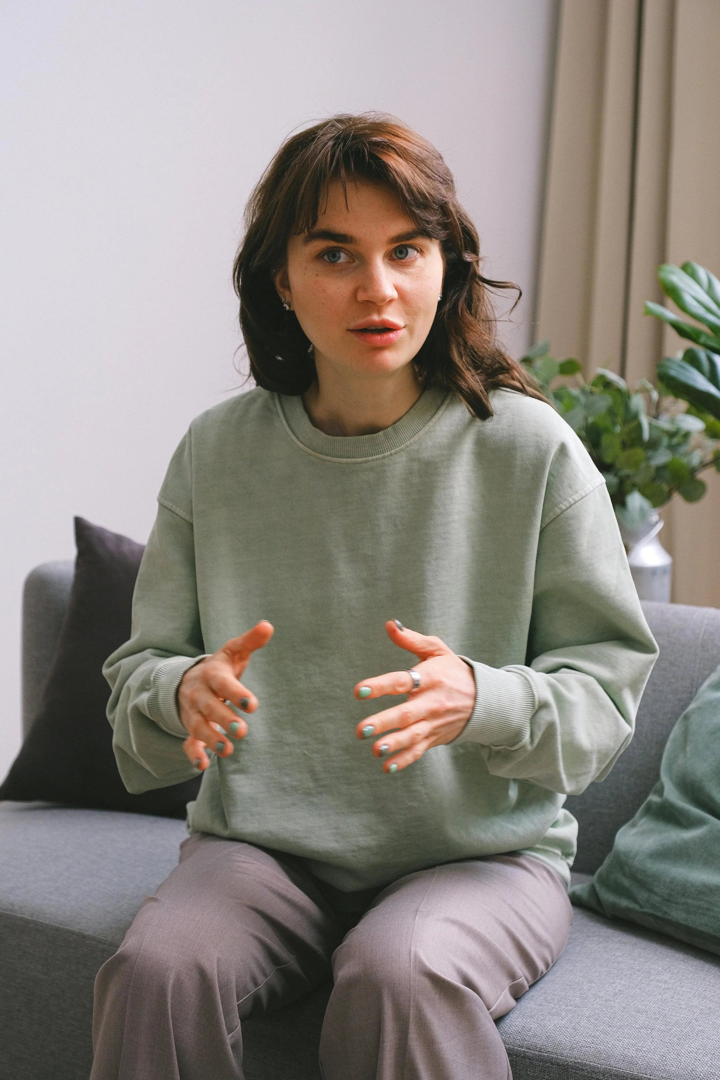 Young woman seated comfortably in a calm therapy environment
