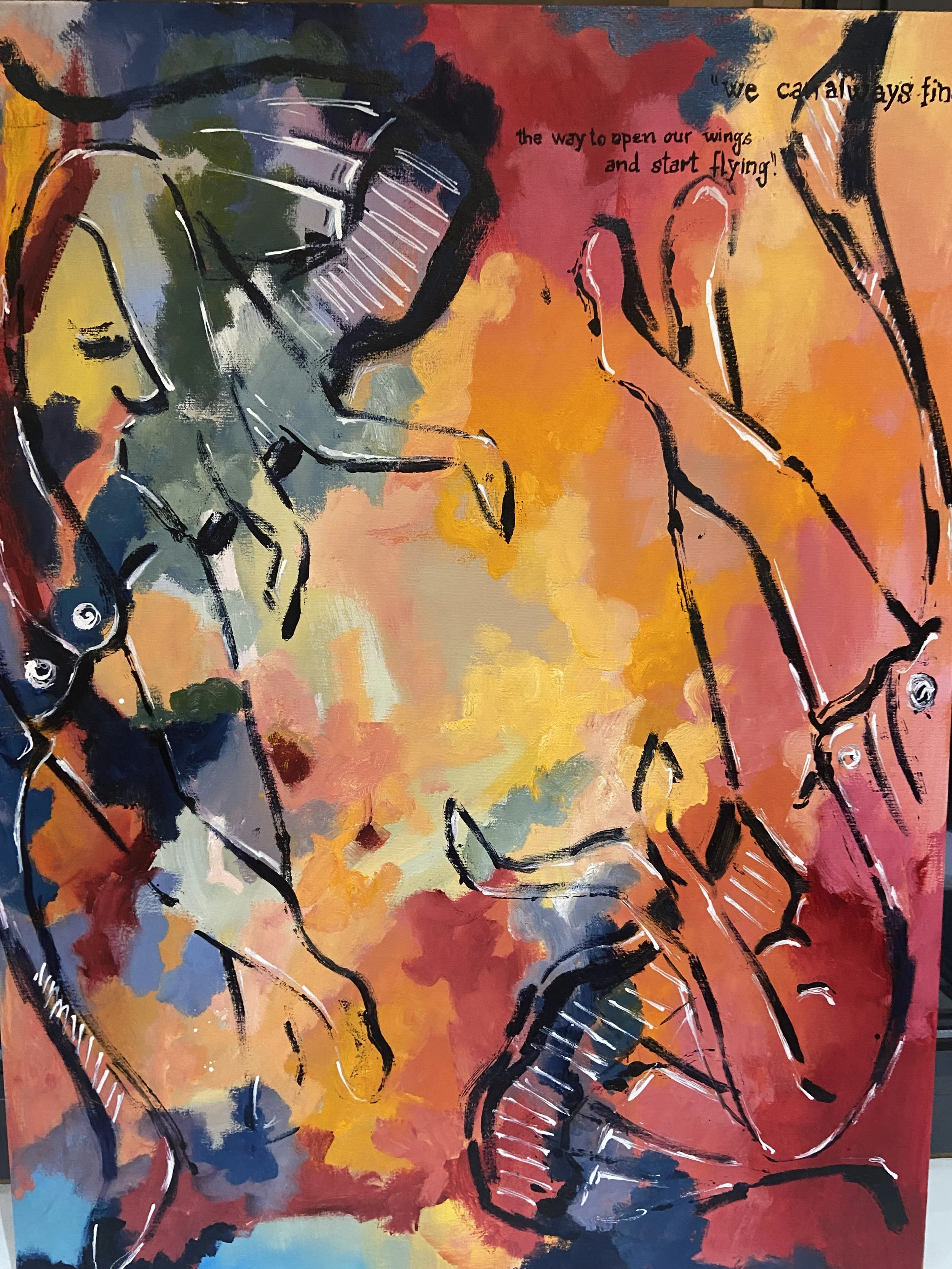 Abstract painting featuring two abstracted figures of horses, with bold black outlines and vibrant background colors of red, orange, yellow, blue, and green. Text on the artwork reads, 'we can always find the way to open our wings and start flying!'