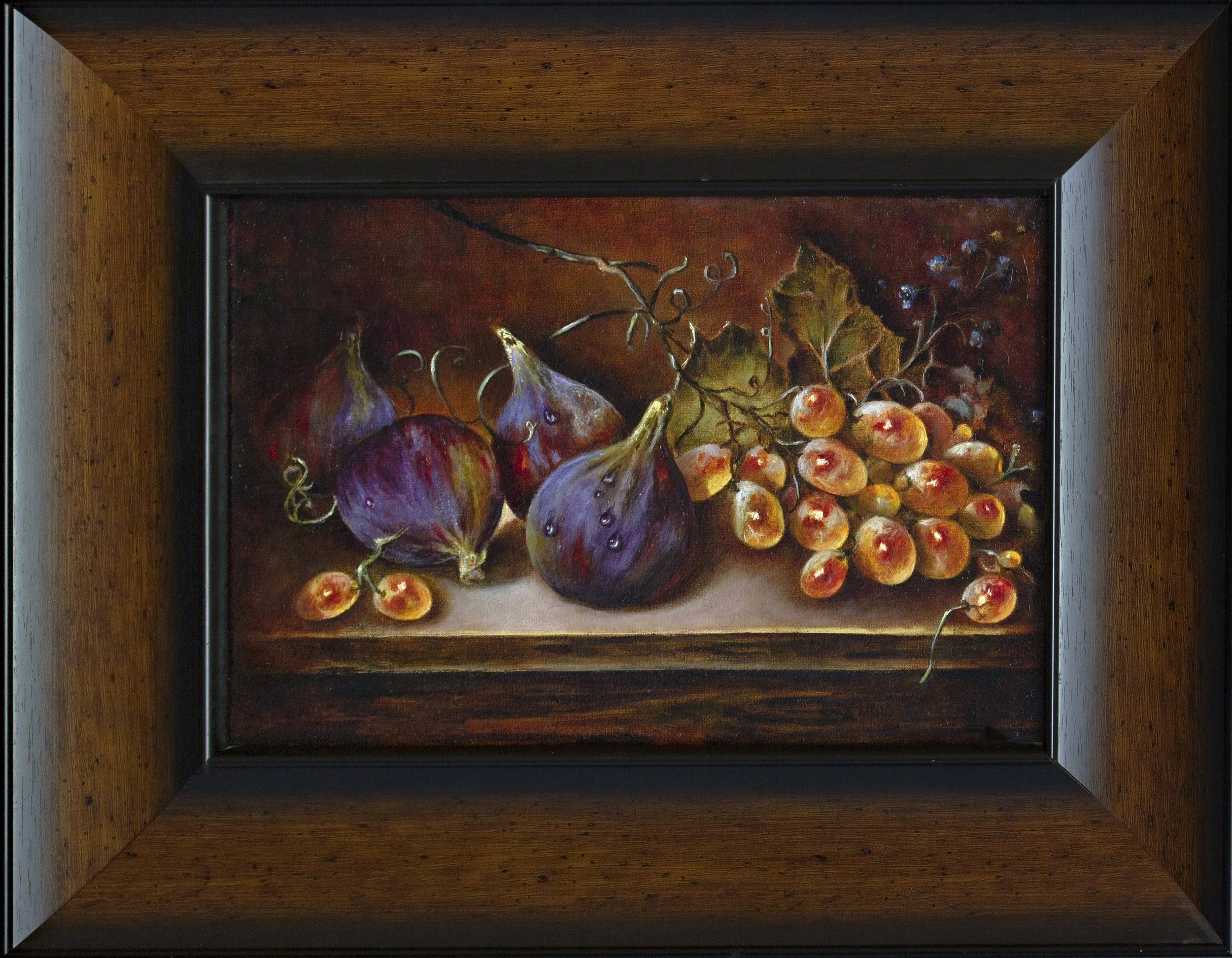 Still life with figs and a bunch of grapes