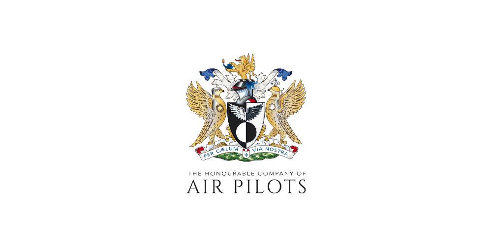 The coat of arms of the Honourable Company of Air Pilots, featuring a shield with a black background, a silver eagle, and a silver helmet, flanked by two golden eagles, with a banner reading "Per Calum Via Nostra." Below, it states "The Honourable Company of Air Pilots."