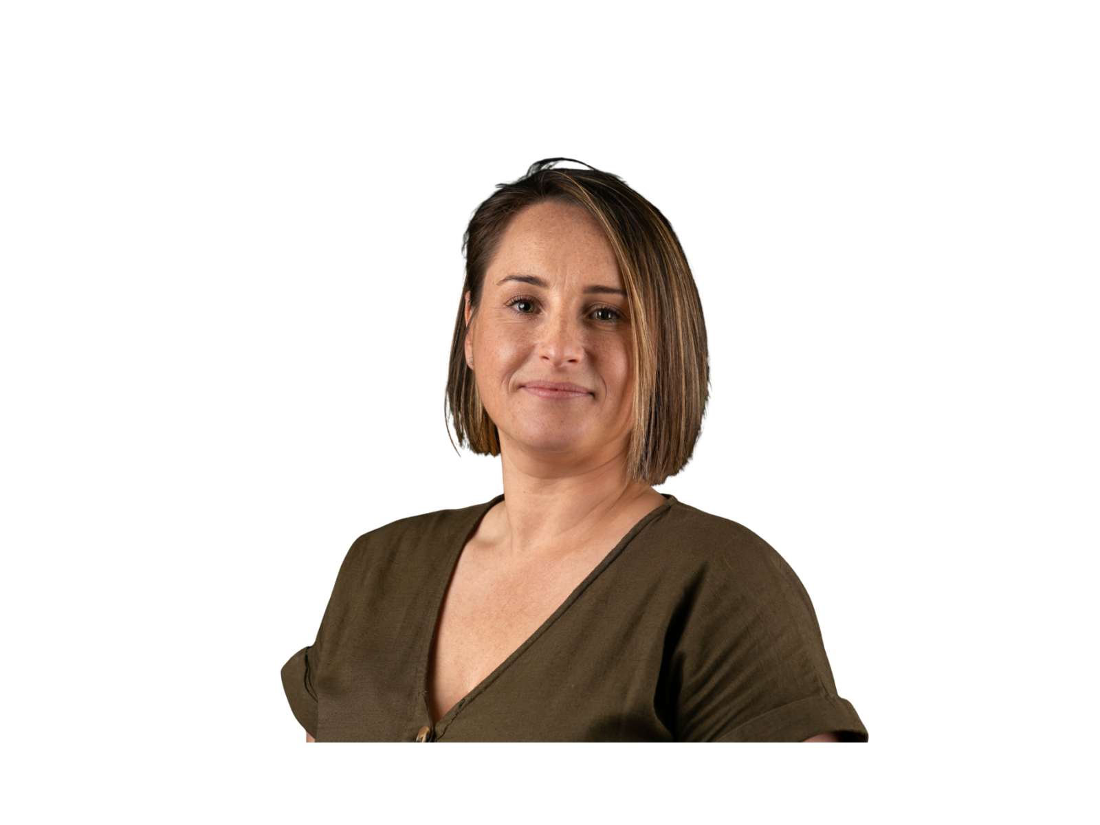A woman with short brown hair, wearing a brown top, looking confidently at the camera with a slight smile against a black background.