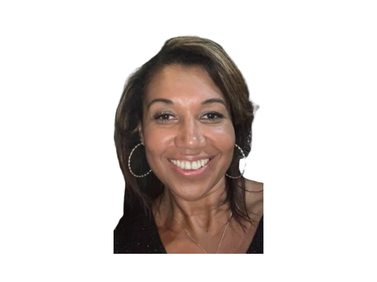 A woman with medium brown hair, smiling, wearing large hoop earrings, a bracelet, a necklace, and a black top with small white dots.