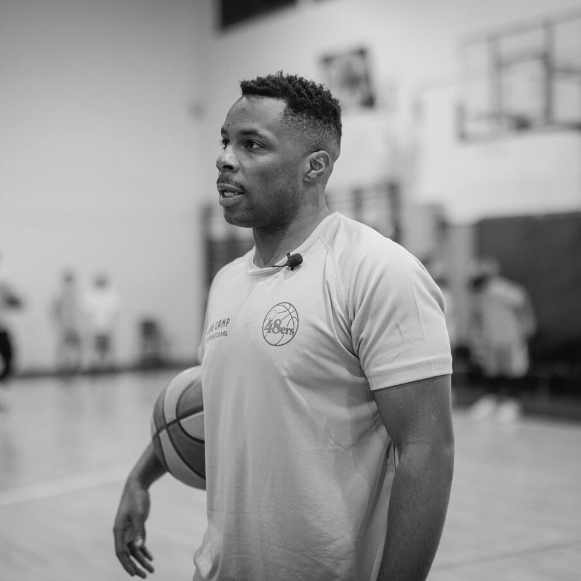 Jared Armstrong holding a ball while leading youth training session, representing mentorship, leadership, and community impact through JAB Courts