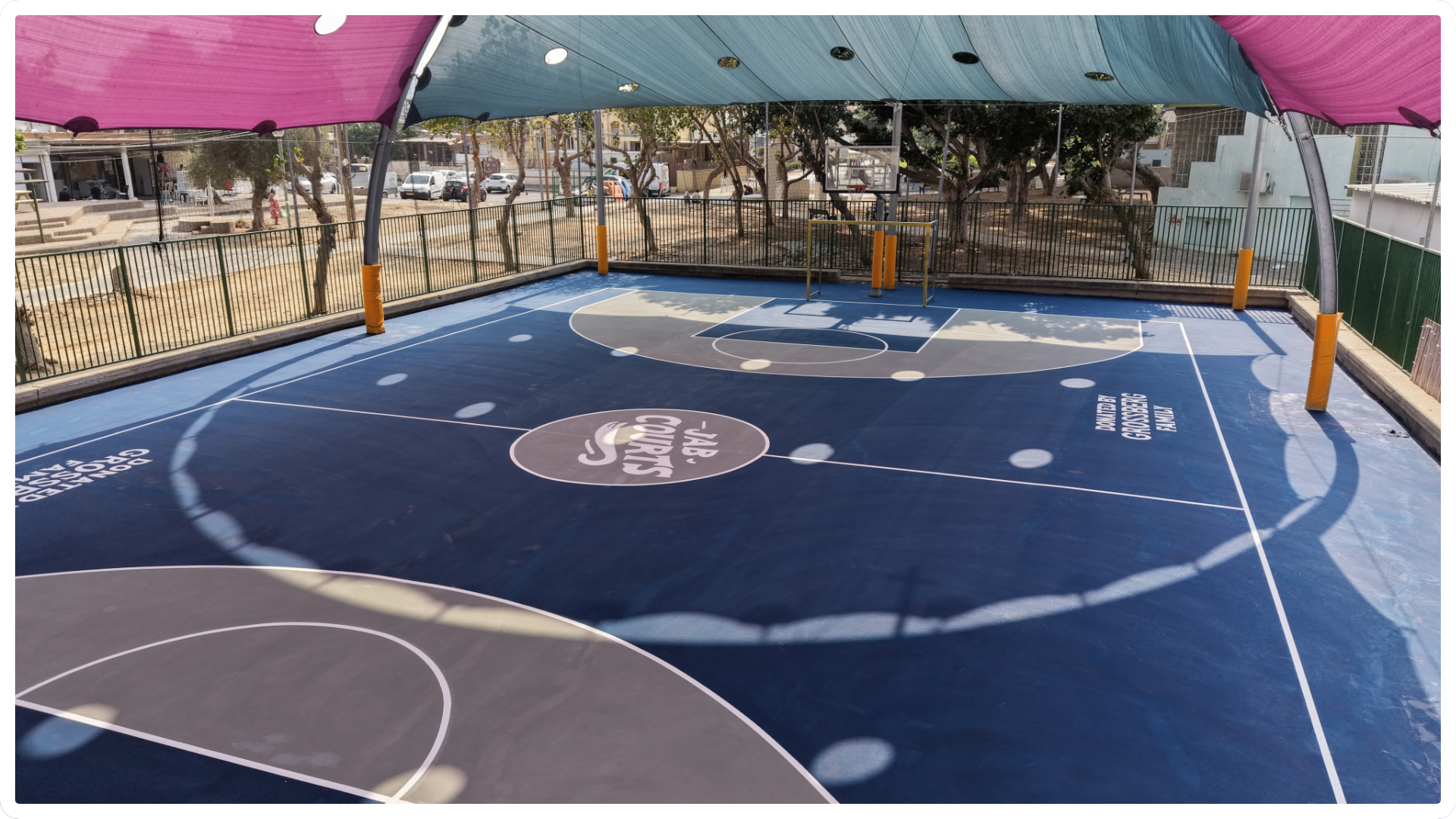 Renovated covered basketball court by JAB Courts supporting year-round youth development and play