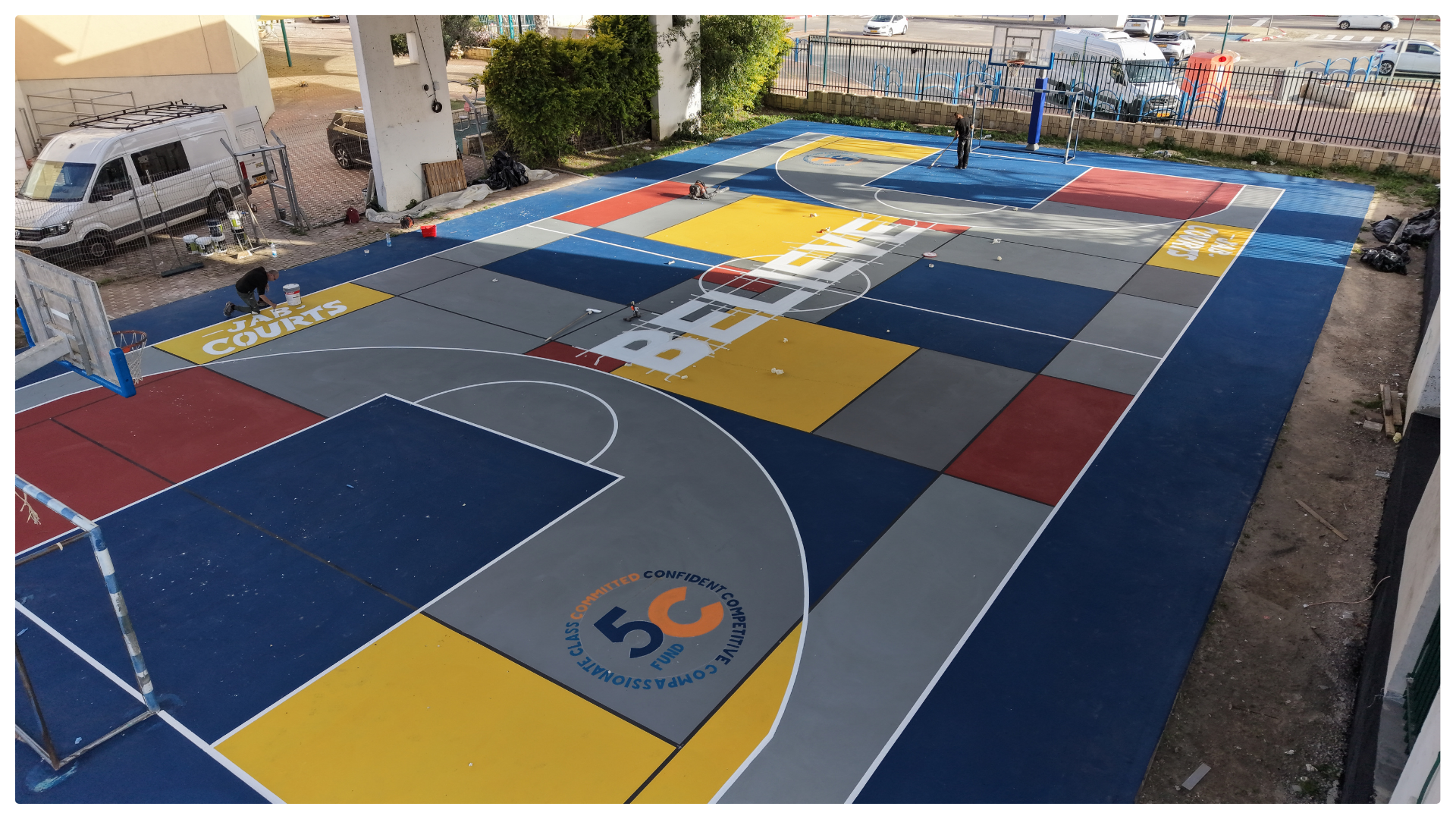 Multi-color basketball court renovation by JAB Courts promoting creativity, play, and youth impact