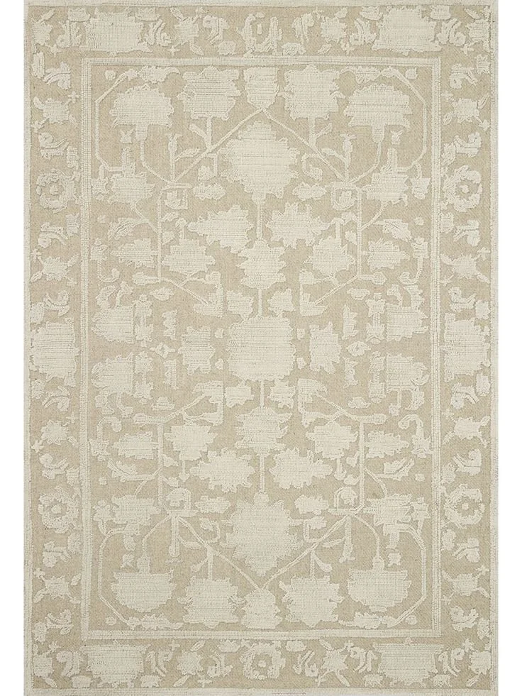 A beige and cream patterned area rug with floral and geometric designs.