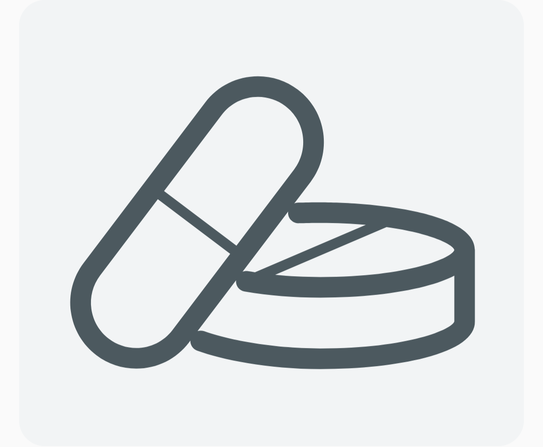 Line drawing of a pill and a round tablet