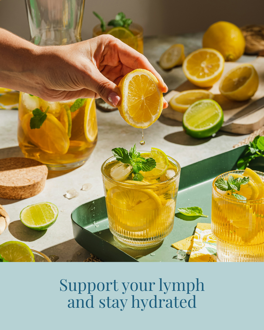 Someone preparing an electrolyte drink with lemon and lime that allows the lymphatic system to move fluid efficiently